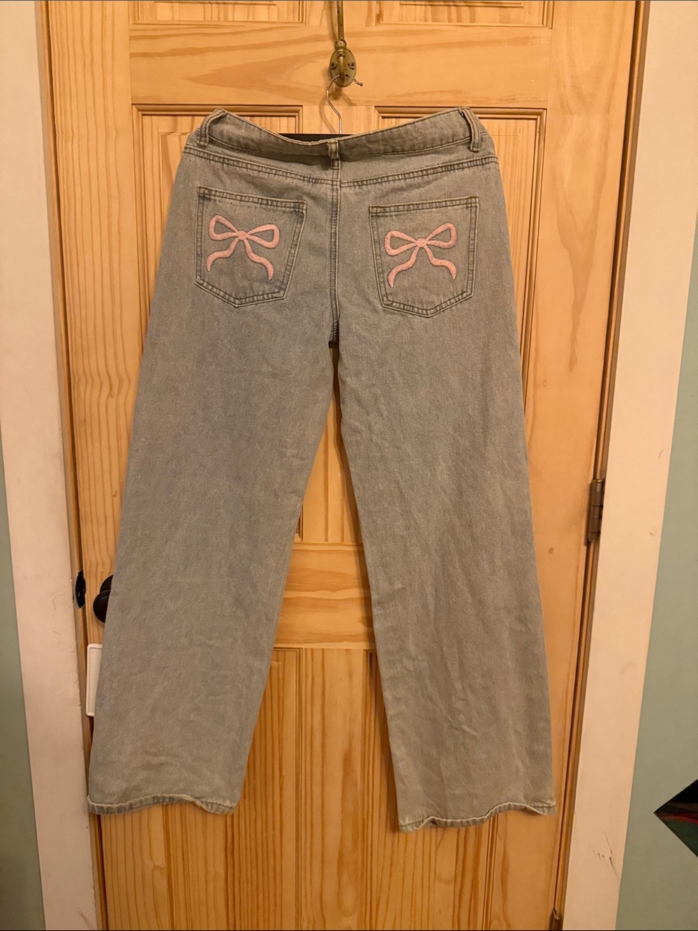 Edikted Light Wash Jeans with Pink Bow Back Pocket Embroidery